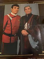 Front side showing Sarek and Spock in red Starfleet uniforms