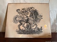 Full view of monochrome unicorn and rabbit print sealed on board