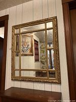 Front view of Bombay Company Venetian Gold mirror hanging on wall