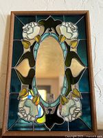 Full view of stained glass mirror in frame