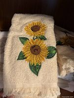 Cream towel with sunflower embroidery