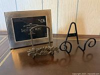 Front view of picture frame and two stands