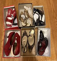 Top view of six boxed pairs of women’s shoes