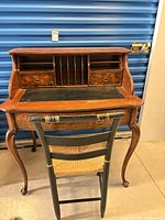 Full view secretary desk with chair in front