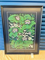 Full view of framed ducks and lotus flower print