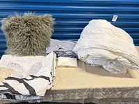 All bedding items and pillow displayed