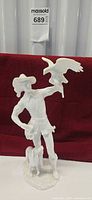 Full front view of porcelain falconer figurine