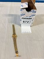 Watch with MaxSold tag and box