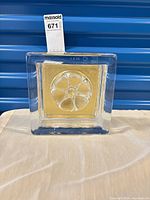 front view showing wheel motif and gold foil