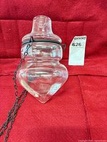 Complete crystal planter/candle holder with chain and lot tag visible against red background