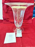 Full view of crystal vase with pamphlet