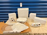 Full lot showing boxed Princess House items, baking dish, napkin holder, butter dish, glass plates