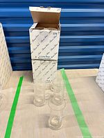 Open Princess House box and four crystal mugs displayed