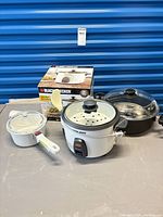 Group of rice cooker, egg poacher, Princess House saucepan and accessories