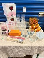 Overview of all glassware, Pyrex dish, measuring cups, candle, boxed wine glasses