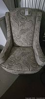 Front view of paisley wingback chair