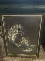 Full view of framed charcoal vase and flowers artwork