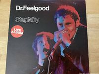 Front cover showing title, artist, live photo, condition of sleeve