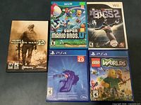 All five game cases laid out showing cover art and platforms