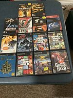 Grid shot of all fourteen PS2 game cases