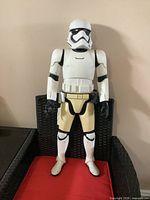 Front view of 32" Stormtrooper action figure standing on chair