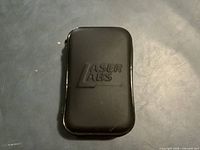 Front of black carrying case with embossed Laser Labs logo