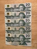 Five 1991 Canada $20 notes obverse side stacked