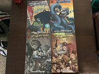 All four Atomic Robo trade paperbacks laid out