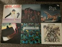 Front covers of six vinyl LP records