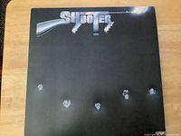 Front album cover showing Shooter logo