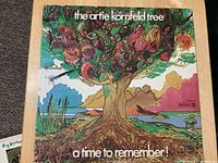 Front jacket showing psychedelic tree artwork and title