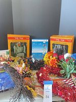 Group shot of all items including boxed ghouls, LED lights, florals, tinsel, stationery and costume