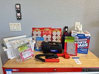 Group shot of inflator, felt pads, Scotch pads, rag box, baskets