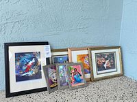 Group shot of all six framed Disney art prints