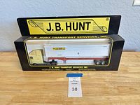 Front view of boxed J.B. Hunt die-cast tractor trailer