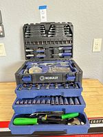 overall view of Kobalt multi-drawer case with drawers open showing sockets and pliers