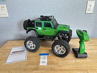 Monster truck with controller and manual on table