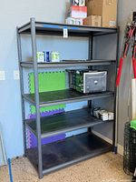Front view first shelving unit with items present for scale
