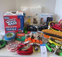 All lot items overview including straps, tape, radio, rags