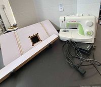 Singer 3229 sewing machine with foot pedal, extension table and guide rails on tabletop