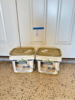 Two Techniseal EZSand buckets front view showing labels and lids