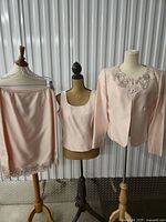 Full view of skirt, shell, jacket on mannequins