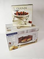 Both product boxes: Cascade bowl box atop Durabrand toaster oven box