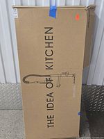 Sealed carton marked "THE IDEA OF KITCHEN" showing product outline