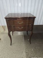 wooden French provincial–style flatware chest exterior