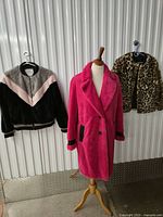 Group shot of all three faux-fur outerwear items on display