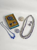 All seven jewelry pieces arranged together