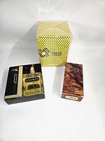 All three boxed fragrance products displayed