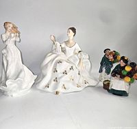 All four figurines grouped left-to-right for scale and completeness