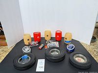 Entire lot overview showing ashtrays front, can holders rear, die-cast and pods centre